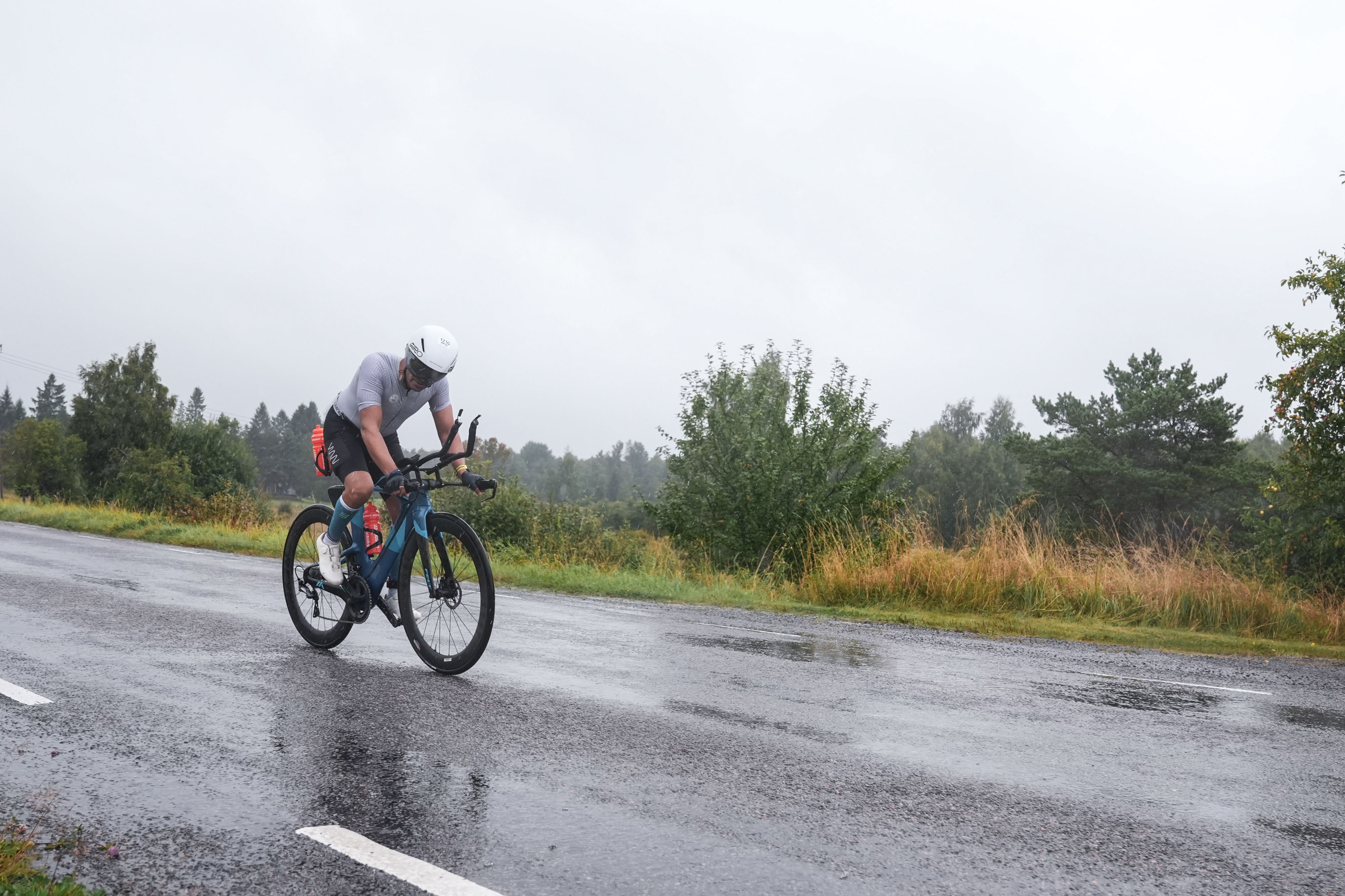 Vivek Sharma on the bike at Ironman Tallinn 2026 in heavy rain