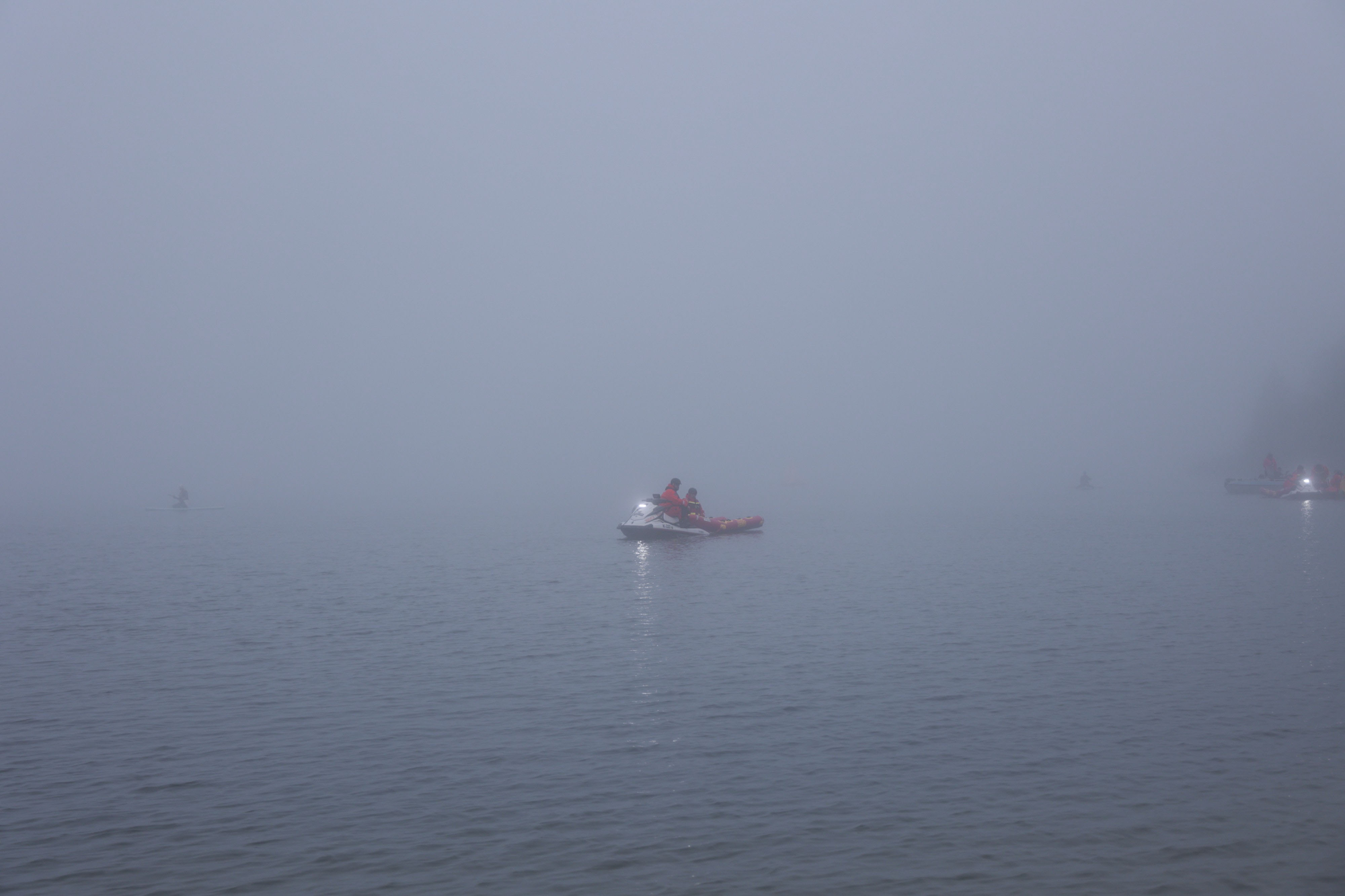 Safety kayak in thick Baltic Sea fog before the Ironman Tallinn swim start — race delayed 30 minutes