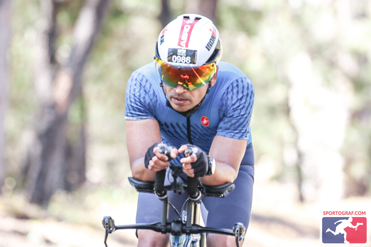 Vivek in aero position on the 180km bike course at Ironman Western Australia